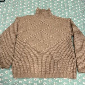 Light brown turtleneck sweater, front and back or pretty much the same